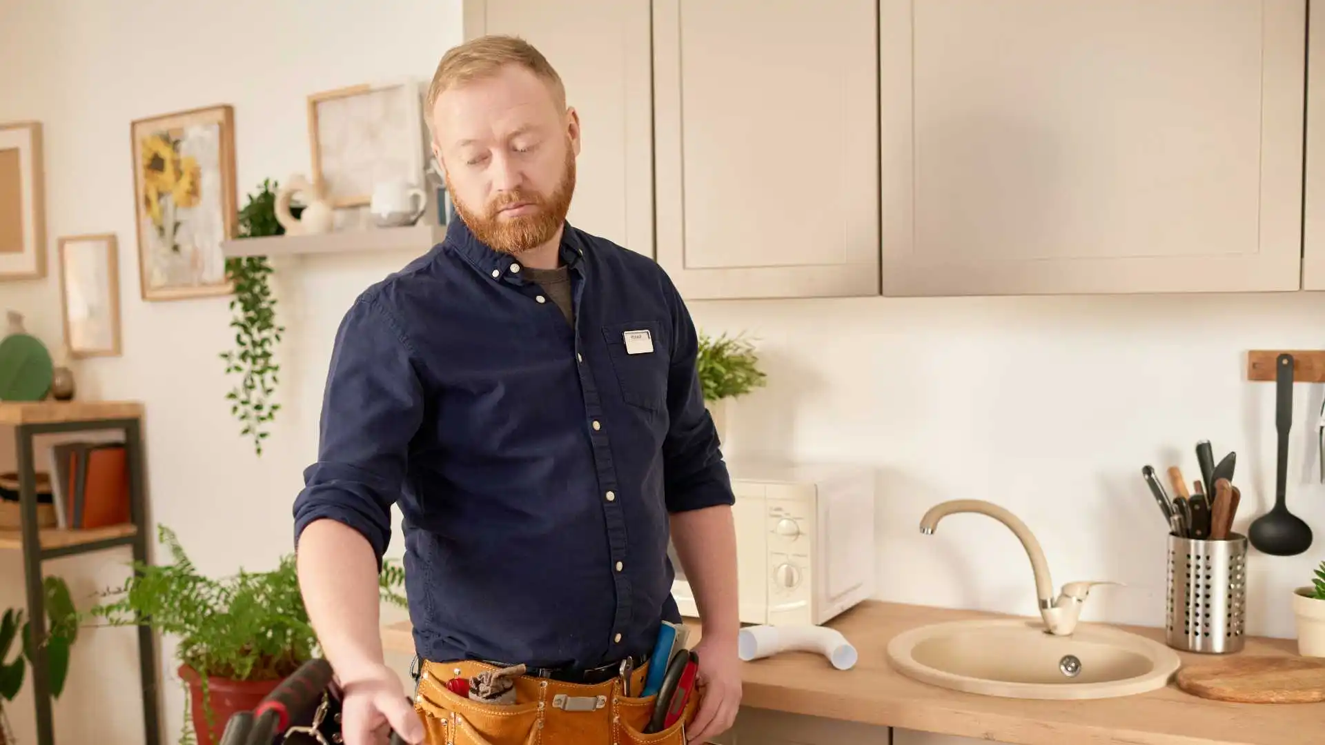 Plumber checking house extension