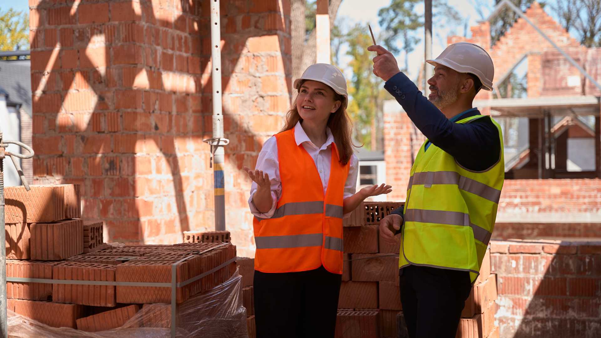 Builders-checking-bricks-in-house-extension Builders-checking-bricks-in-house-extension